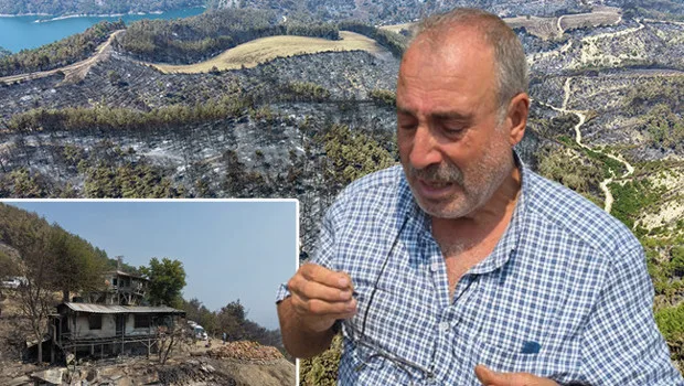 Adana Kozan'daki orman yangınında evi yanan Meryem ve Halil Bozkurt çifti, küle dönen evlerinin önünde duruyor.
