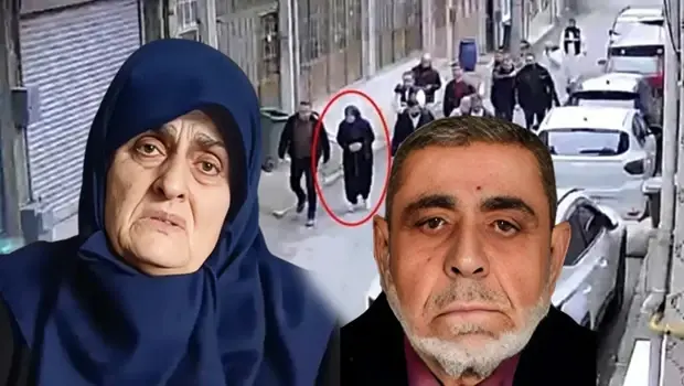 Bursa'da cinayetin işlendiği apartman önünde polis ekipleri inceleme yapıyor.